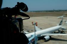 Video camera observing airplane